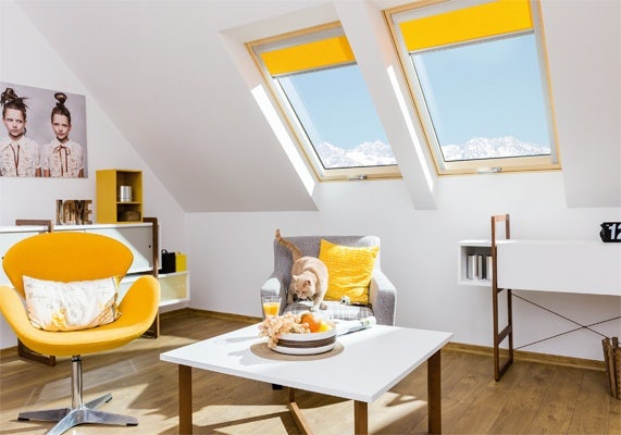 FAKRO noise reduction windows with yellow blinds in loft space